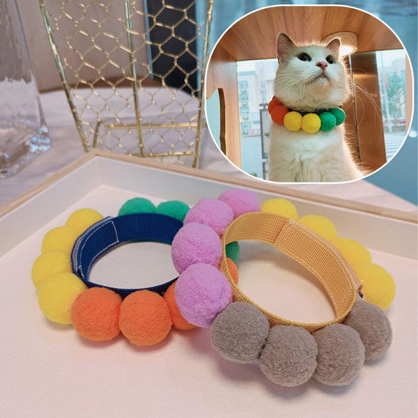 Fur ball bib necklace with bow tie, front view