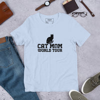 Cat mom world tour graphic featuring a cat, printed on a light t-shirt, front view