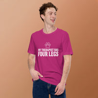 Four-legged therapist graphic featuring a dog, printed on a light t-shirt, front view
