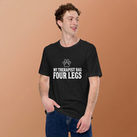 Four-legged therapist graphic featuring a dog, printed on a black t-shirt, front view