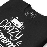 Crazy cat mom graphic featuring a cat, printed on a black t-shirt, front view