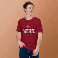 Four-legged therapist graphic featuring a dog, printed on a cardinal t-shirt, front view
