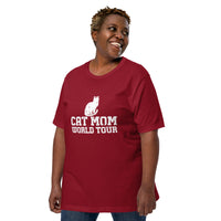 Cat mom world tour graphic featuring a cat, printed on a cardinal t-shirt, front view