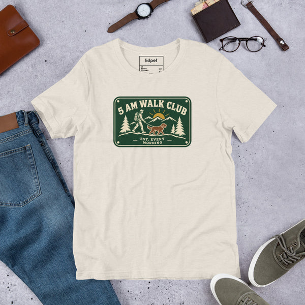 Unisex staple t-shirt showing 5 AM walk club graphic, Heather Dust, front view