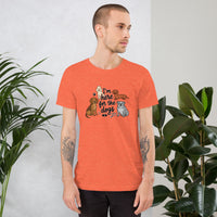 I'm here for the dogs graphic featuring dogs, printed on a heather t-shirt, front view