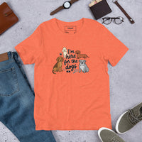I'm here for the dogs graphic featuring dogs, printed on a heather t-shirt, front view