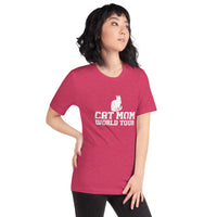 Cat mom world tour graphic featuring a cat, printed on a heather raspberry t-shirt, front view