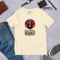 Unisex staple t-shirt showing dogs before dudes graphic, Natural, front view