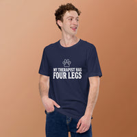 Four-legged therapist graphic featuring a dog, printed on a navy t-shirt, front view