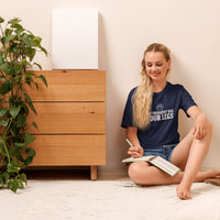 Four-legged therapist graphic featuring a dog, printed on a navy t-shirt, front view