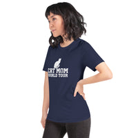 Cat mom world tour graphic featuring a cat, printed on a navy t-shirt, front view