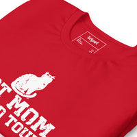 Cat mom world tour graphic featuring a cat, printed on a red t-shirt, front view
