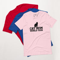Cat mom world tour graphic featuring a cat, printed on a pink t-shirt, front view