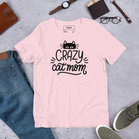 Crazy cat mom graphic featuring a cat, printed on a pink t-shirt, front view
