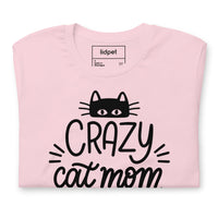 Crazy cat mom graphic featuring a cat, printed on a pink t-shirt, front view