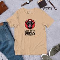 Unisex staple t-shirt showing dogs before dudes graphic, Tan, front view