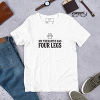 Four-legged therapist graphic featuring a dog, printed on a white t-shirt, front view